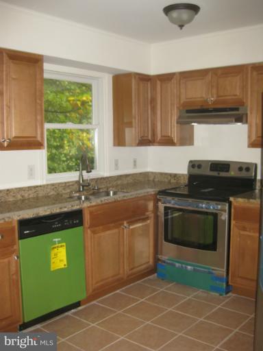 1744 Brookshire Run Point of Rocks, MD 21777 - Photo 5 of 15 a kitchen with a stove and a sink