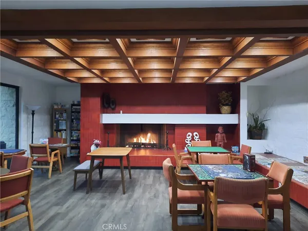 a living room with lots of furniture and chandelier