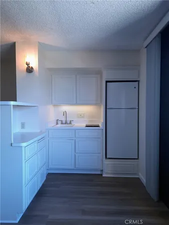 a room with cabinets and wooden floor