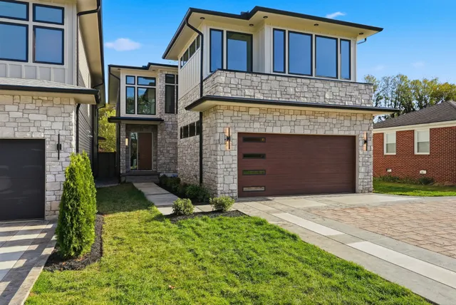 a view of a house with a small yard and plants