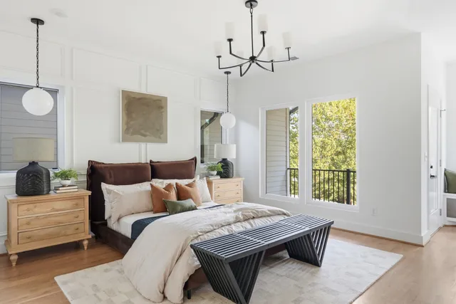 a bedroom with bed and window