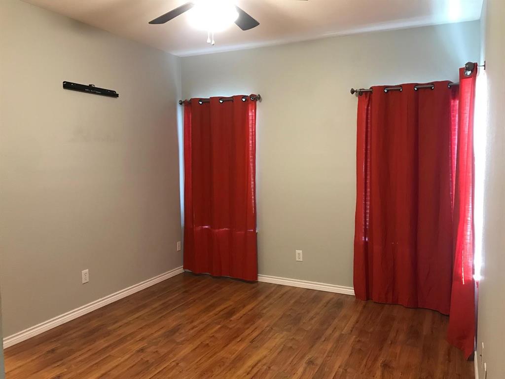 3016 Penniman Road Denton, TX 76209 - Photo 11 of 15 a view of a room with wooden floor and a window