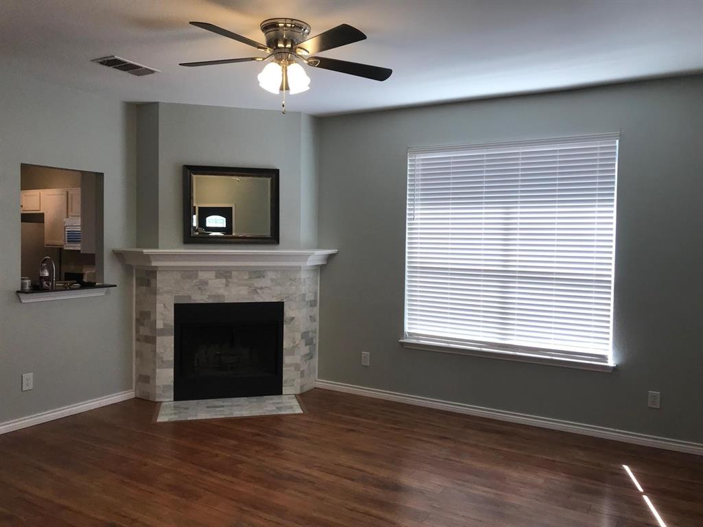 3016 Penniman Road Denton, TX 76209 - Photo 3 of 15 a living room with a fireplace and a window