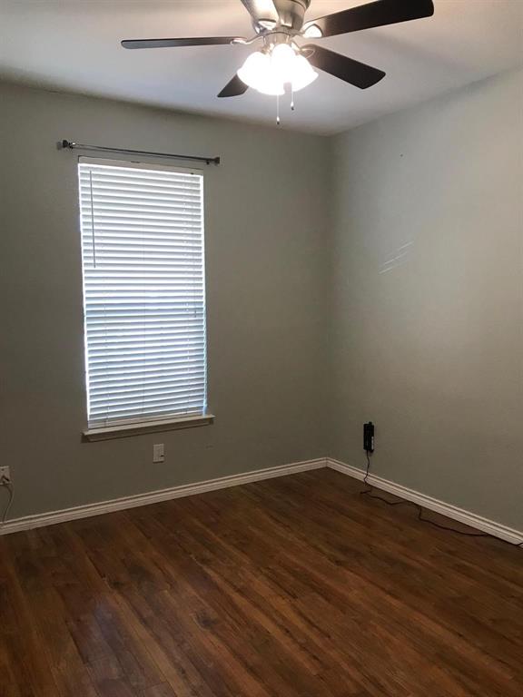 3016 Penniman Road Denton, TX 76209 - Photo 5 of 15 an empty room with wooden floor and windows