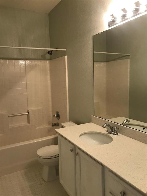 3016 Penniman Road Denton, TX 76209 - Photo 7 of 15 a bathroom with a granite countertop sink toilet and shower