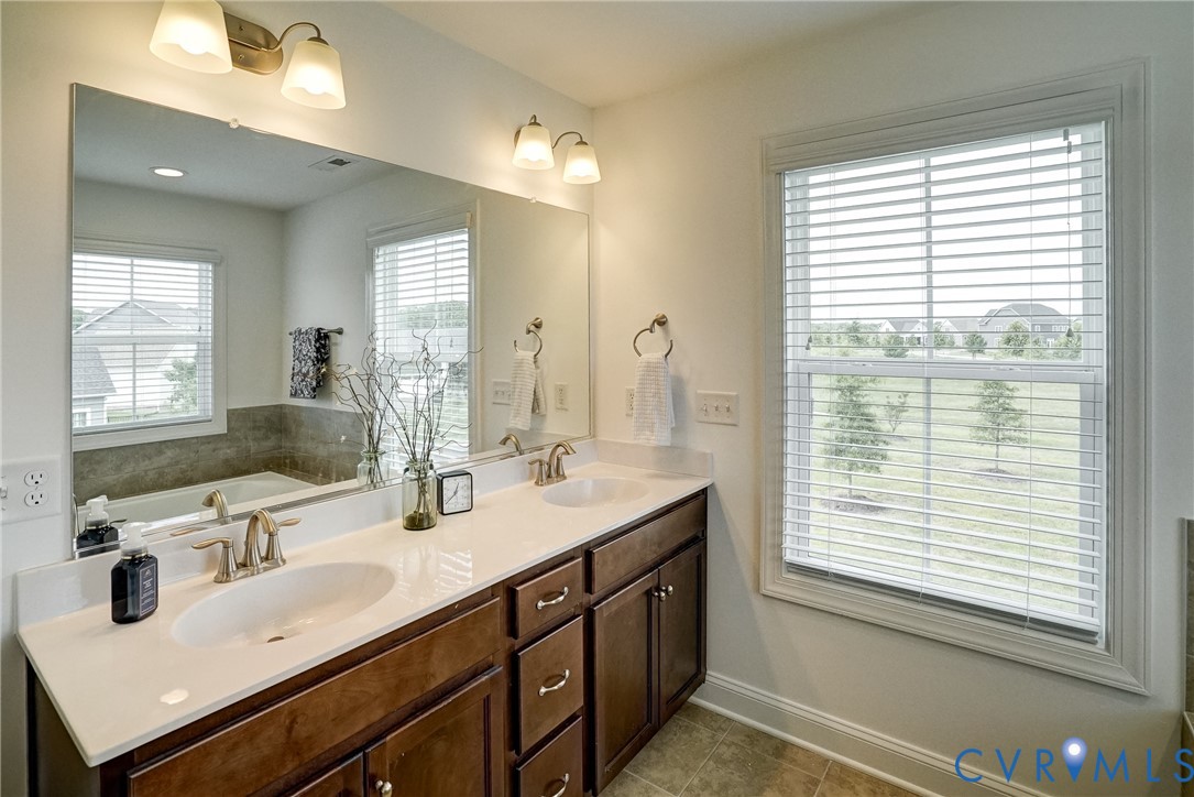 119 Thorncliff Road Ashland, VA 23005 - Photo 13 of 30 a bathroom with double vanity and a mirror