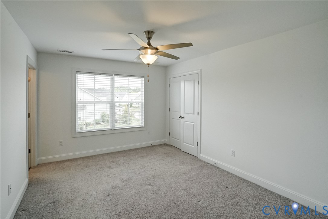 119 Thorncliff Road Ashland, VA 23005 - Photo 17 of 30 an empty room with windows and fan