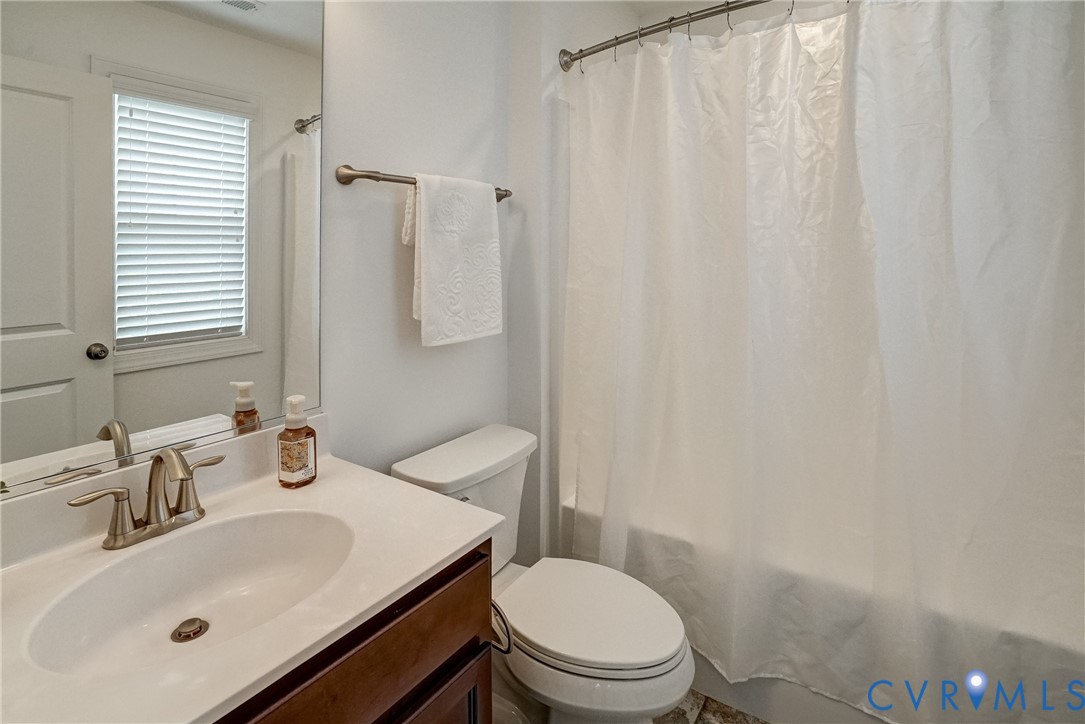 119 Thorncliff Road Ashland, VA 23005 - Photo 18 of 30 a bathroom with a sink toilet and mirror