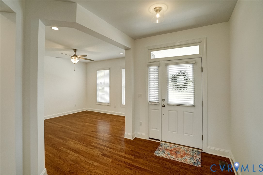 119 Thorncliff Road Ashland, VA 23005 - Photo 2 of 30 a view of an empty room with wooden floor and a window