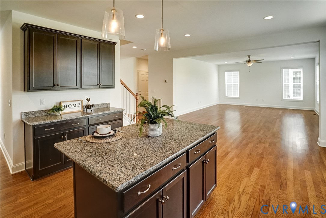 119 Thorncliff Road Ashland, VA 23005 - Photo 5 of 30 a kitchen with granite countertop kitchen island a sink appliances and cabinets