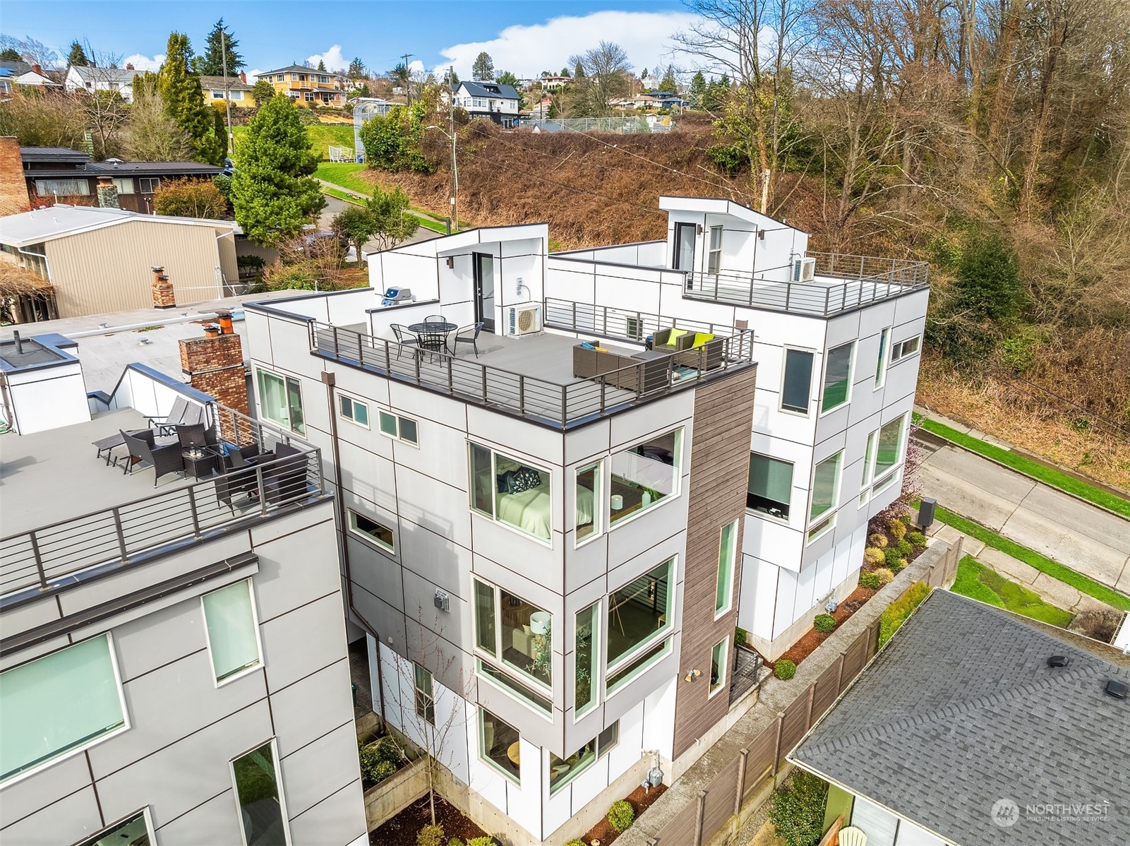 2307 West Raye Street Seattle, WA 98199 - Photo 1 of 38 a aerial view of a multi story residential apartment building