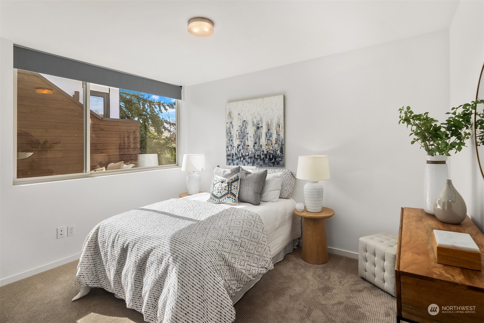 2307 West Raye Street Seattle, WA 98199 - Photo 16 of 38 a bedroom with a bed and a window
