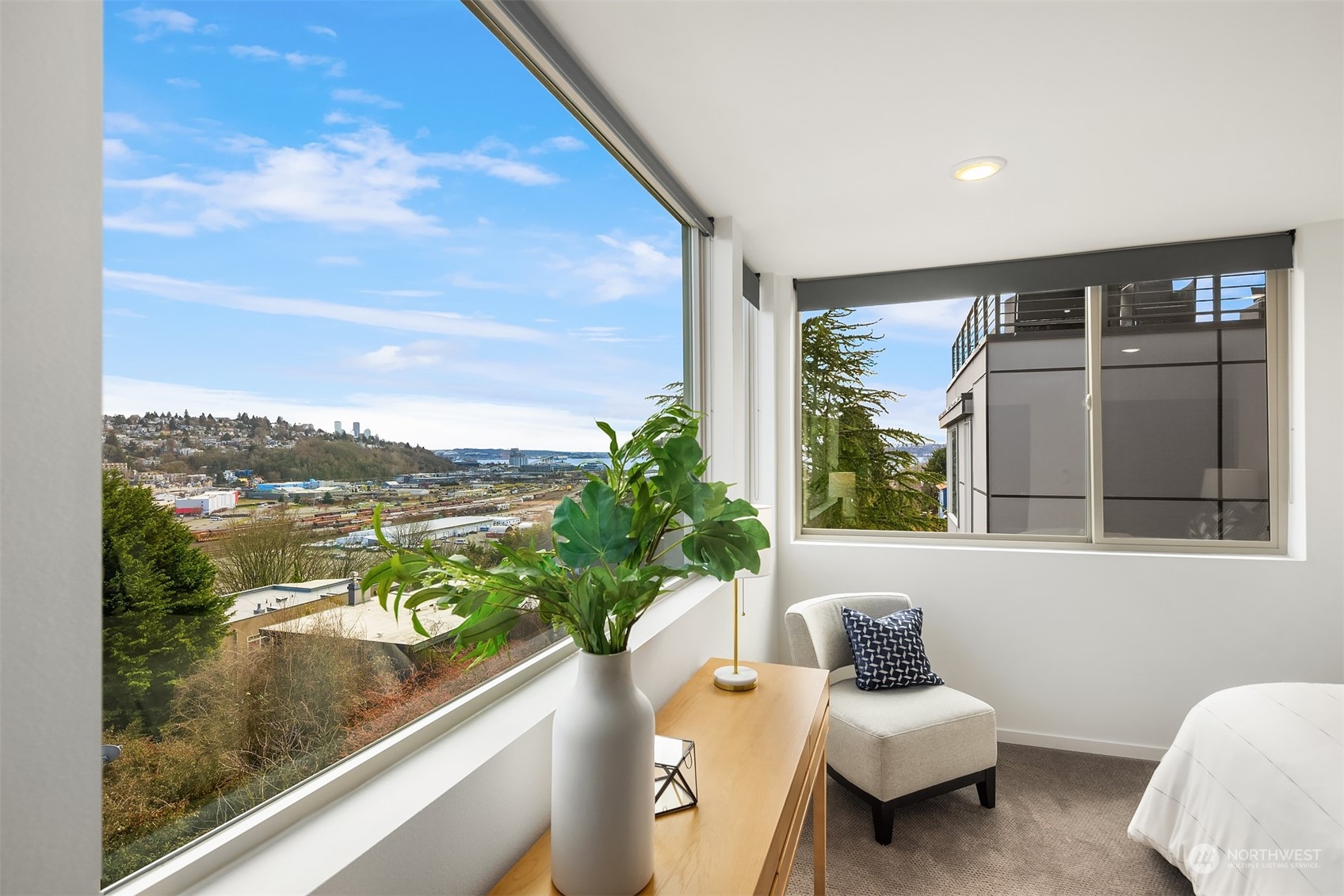 2307 West Raye Street Seattle, WA 98199 - Photo 20 of 38 a view of a balcony with lake view and a potted plant