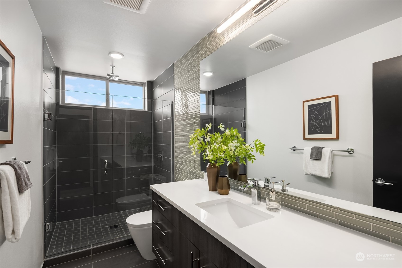 2307 West Raye Street Seattle, WA 98199 - Photo 21 of 38 a bathroom with a sink toilet and shower