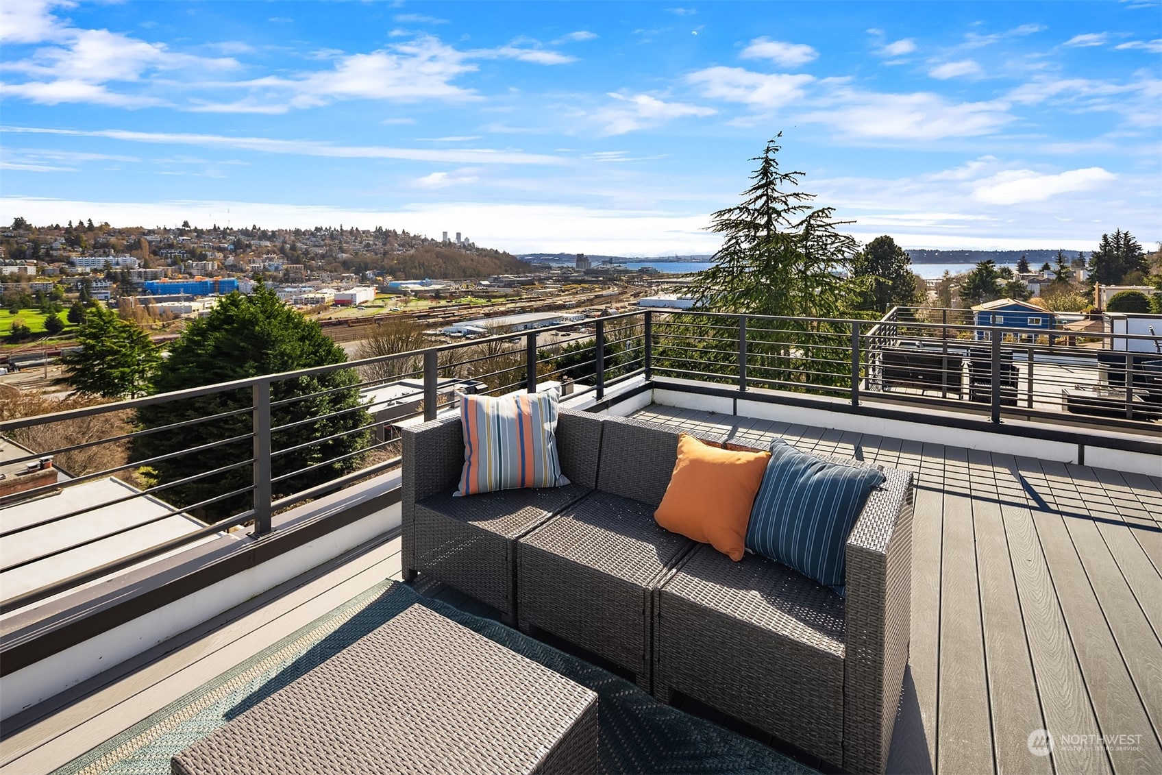 2307 West Raye Street Seattle, WA 98199 - Photo 24 of 38 a view of a roof deck with couches and sky view