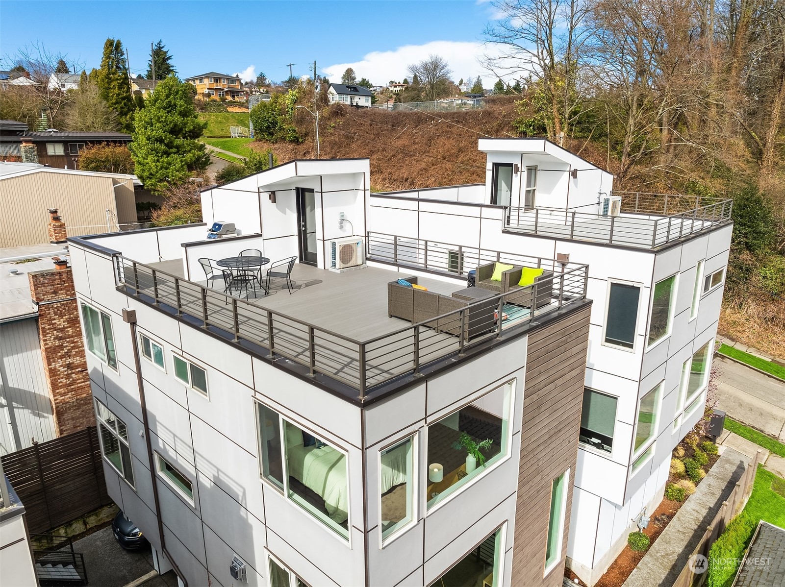 2307 West Raye Street Seattle, WA 98199 - Photo 37 of 38 a view of a house with roof deck and seating space