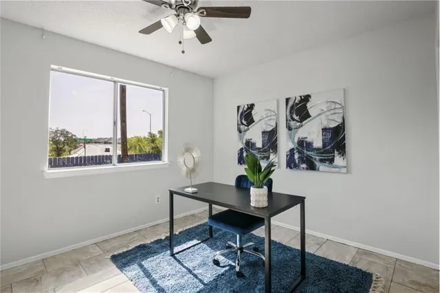 a workspace with furniture and window