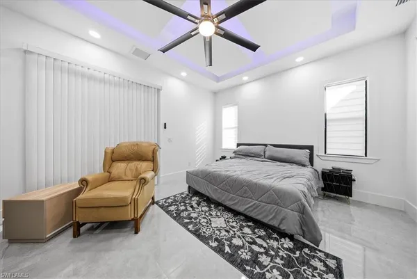 a room with a bed and a dresser