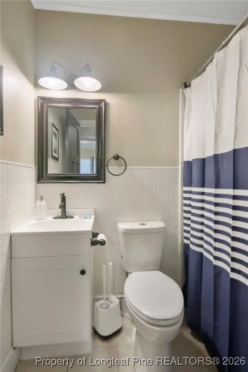 4611 Campground Road Fayetteville, NC 28314 - Photo 11 of 17 a bathroom with a sink a toilet and mirror