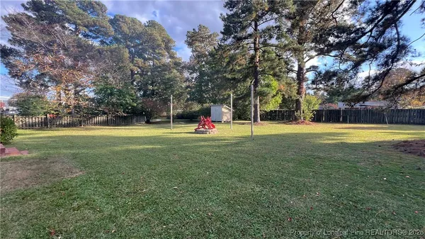 a view of a park with large trees