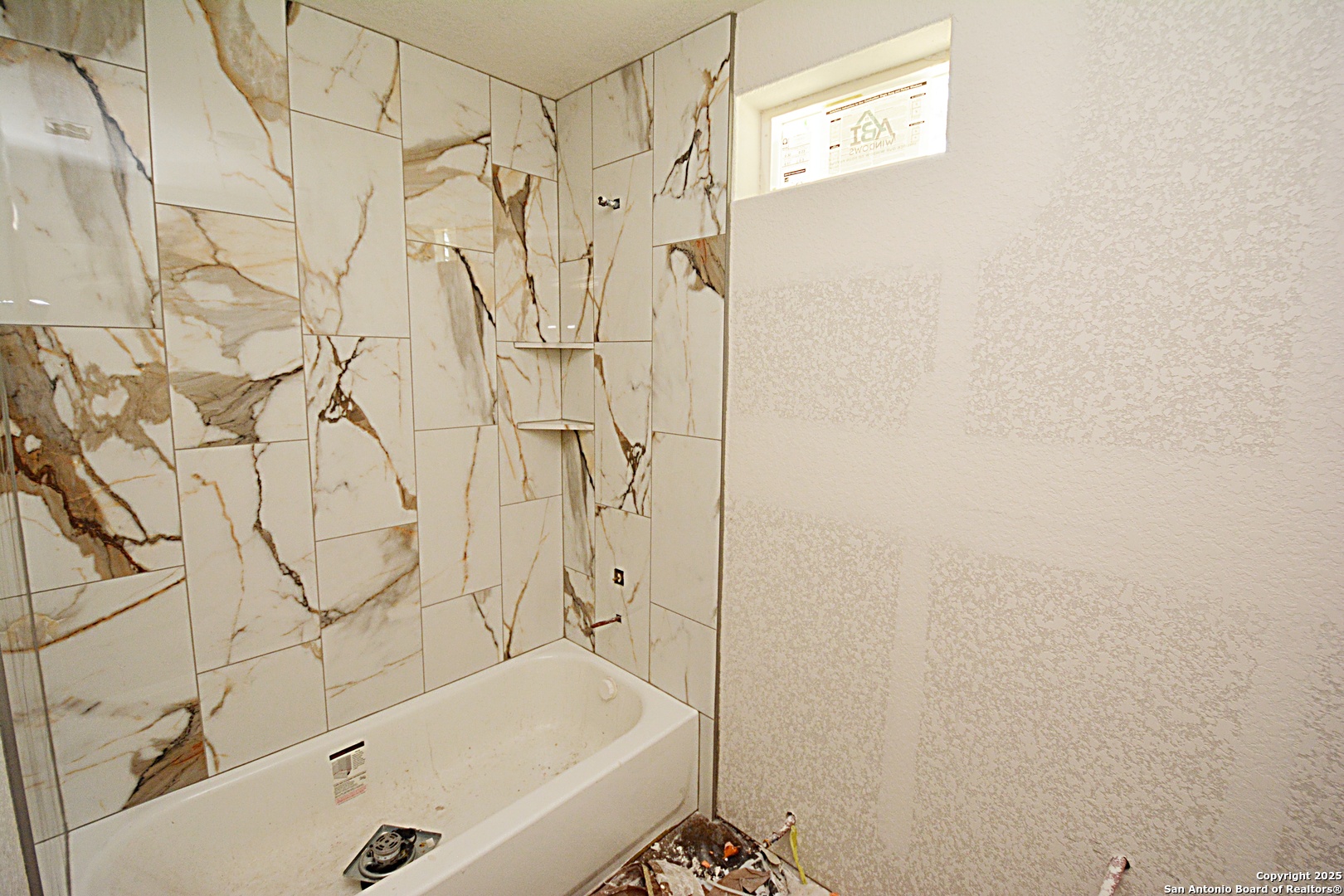 968 High Drive Spring Branch, TX 78070 - Photo 7 of 9 a bathroom with a bathtub and shower