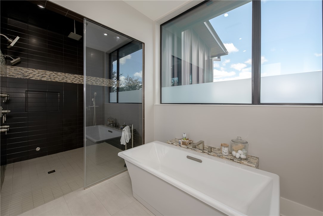 3320 Sycamore Trail Bryan, TX 77807 - Photo 23 of 48 Bathroom featuring a freestanding bath, tile patterned flooring, and a tile shower