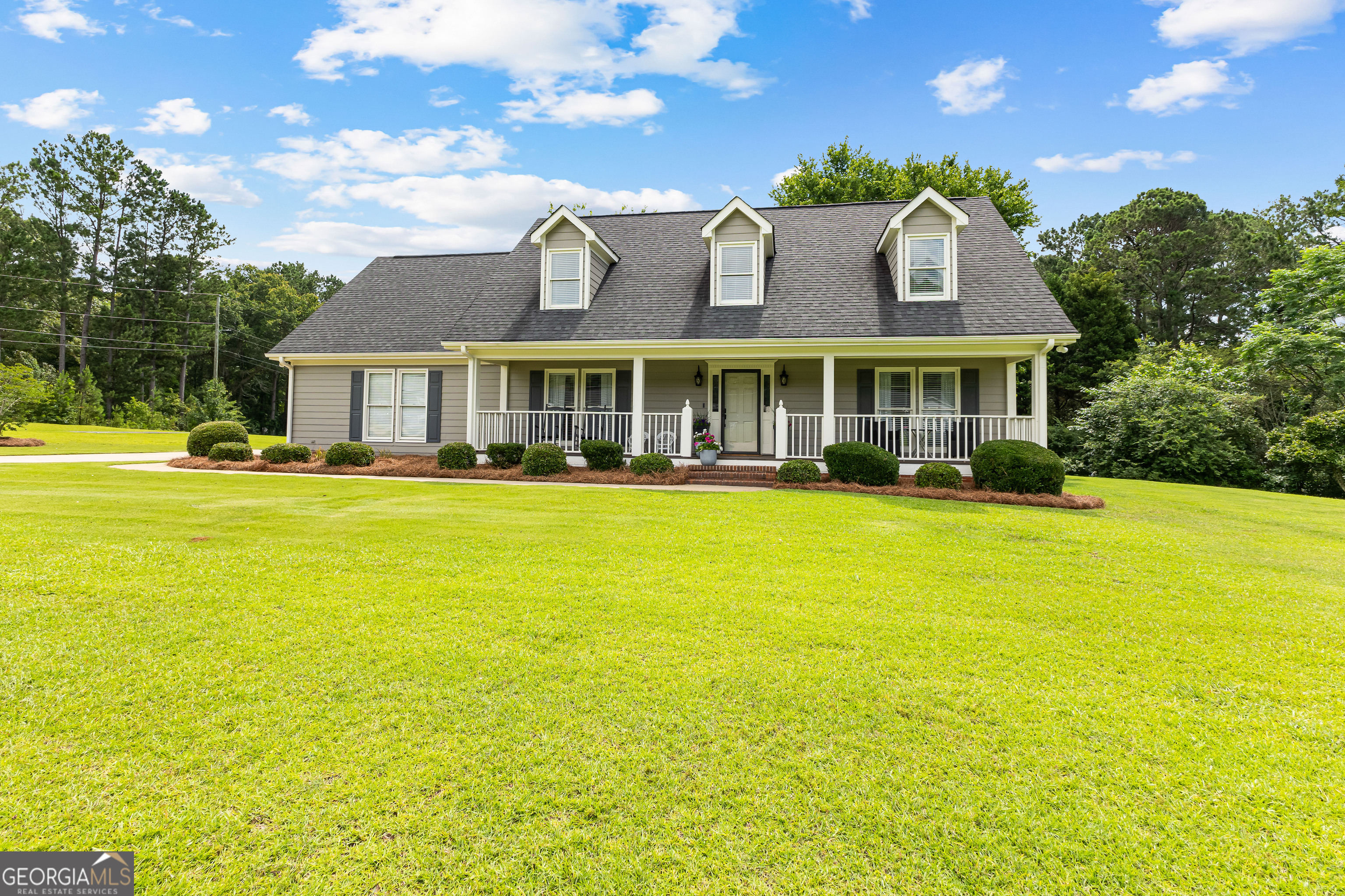 a front view of house with an ocean view