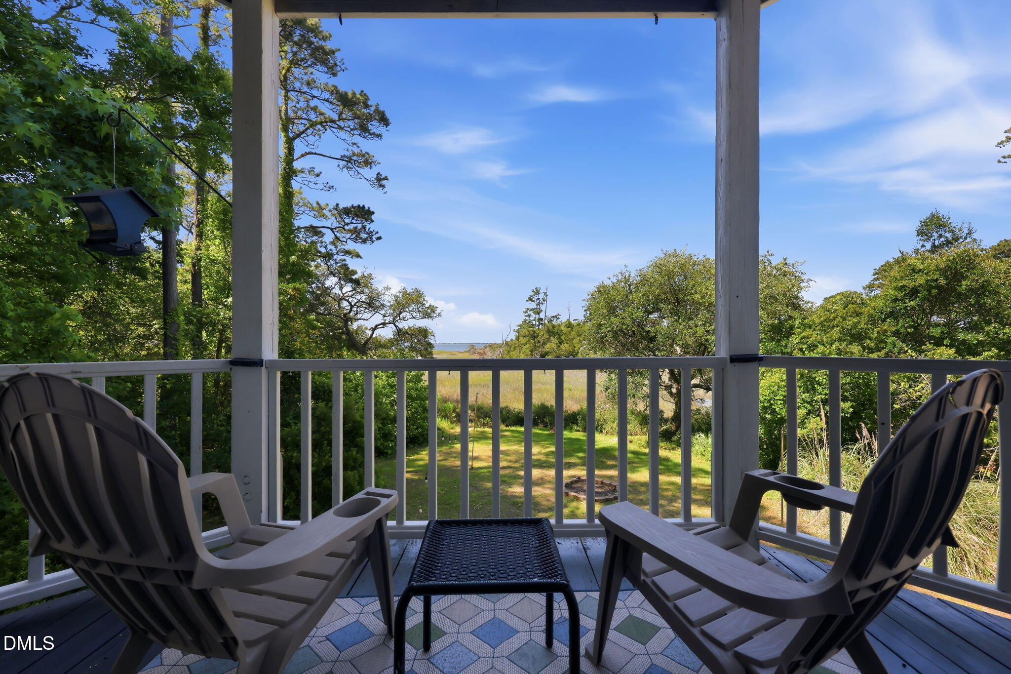 174 Windy Point Road Beaufort, NC 28516 - Photo 10 of 55 Covered seating with views of the back yard, marsh, and ICW. Perfect spot for relaxing.