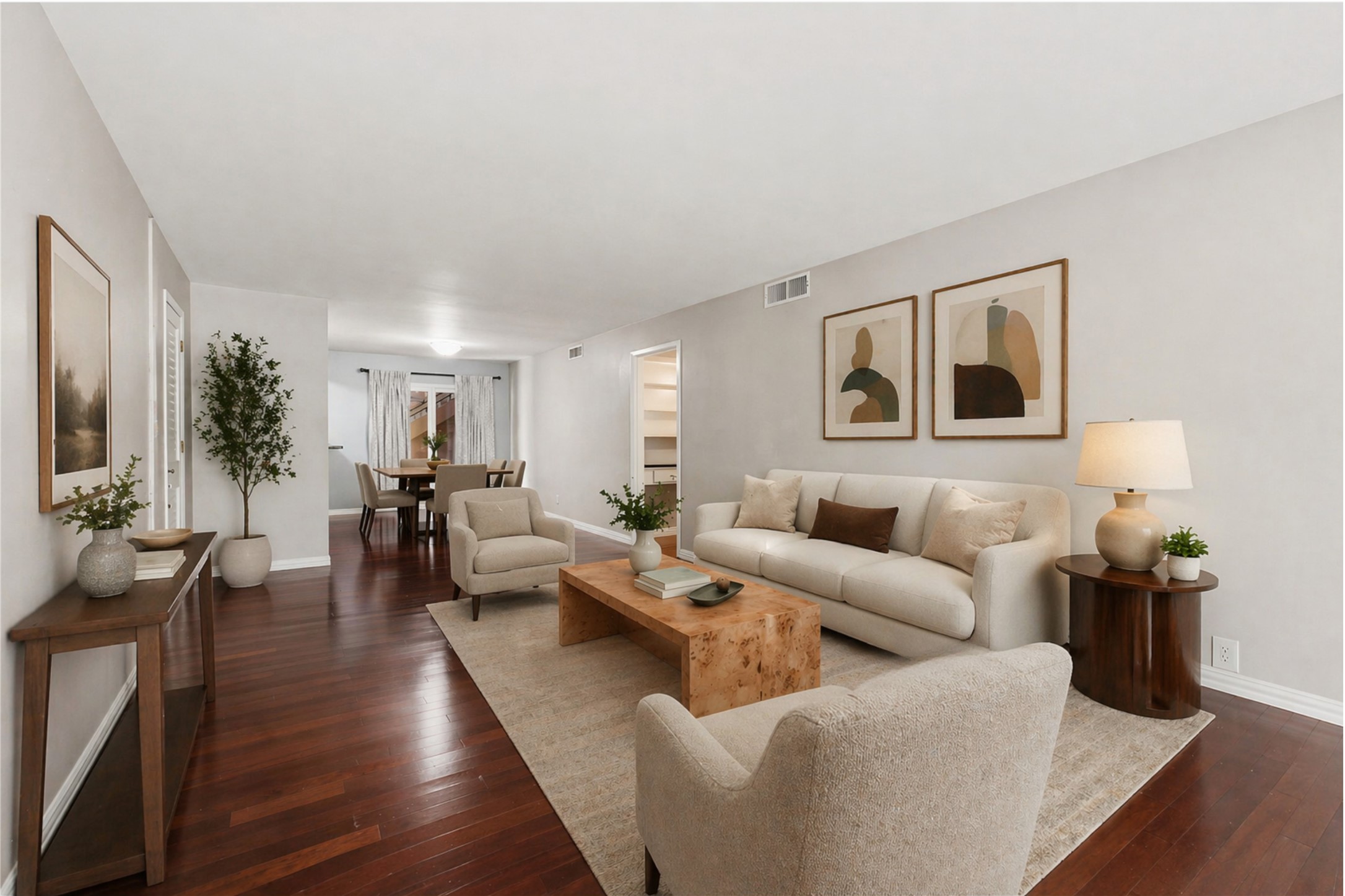 1210 Windsor Road, Unit 104 Austin, TX 78703 - Photo 3 of 27 Spacious living area featuring rich wood-finish flooring, light-toned walls, and recessed lighting