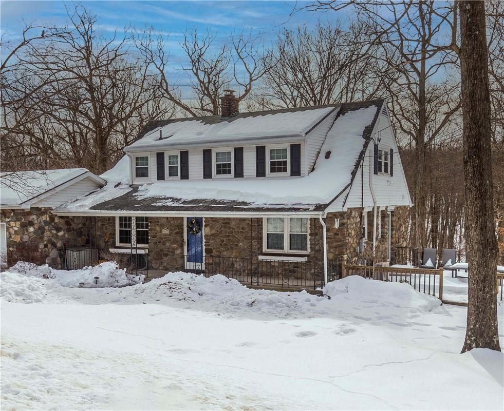 77 Ludlam Road Monroe, NY 10950 - Photo 1 of 1 a front view of a house with a yard covered in snow