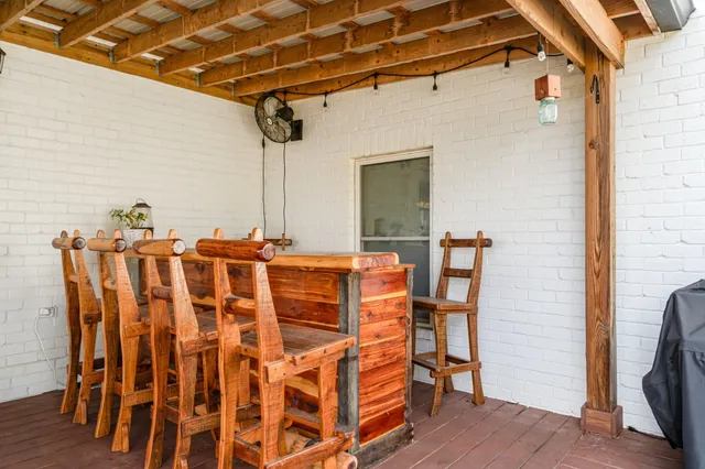 a patio with table and chairs
