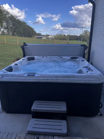 a view of a house with swimming pool and an outdoor space
