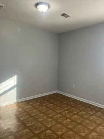 a bathroom with a bathtub and window