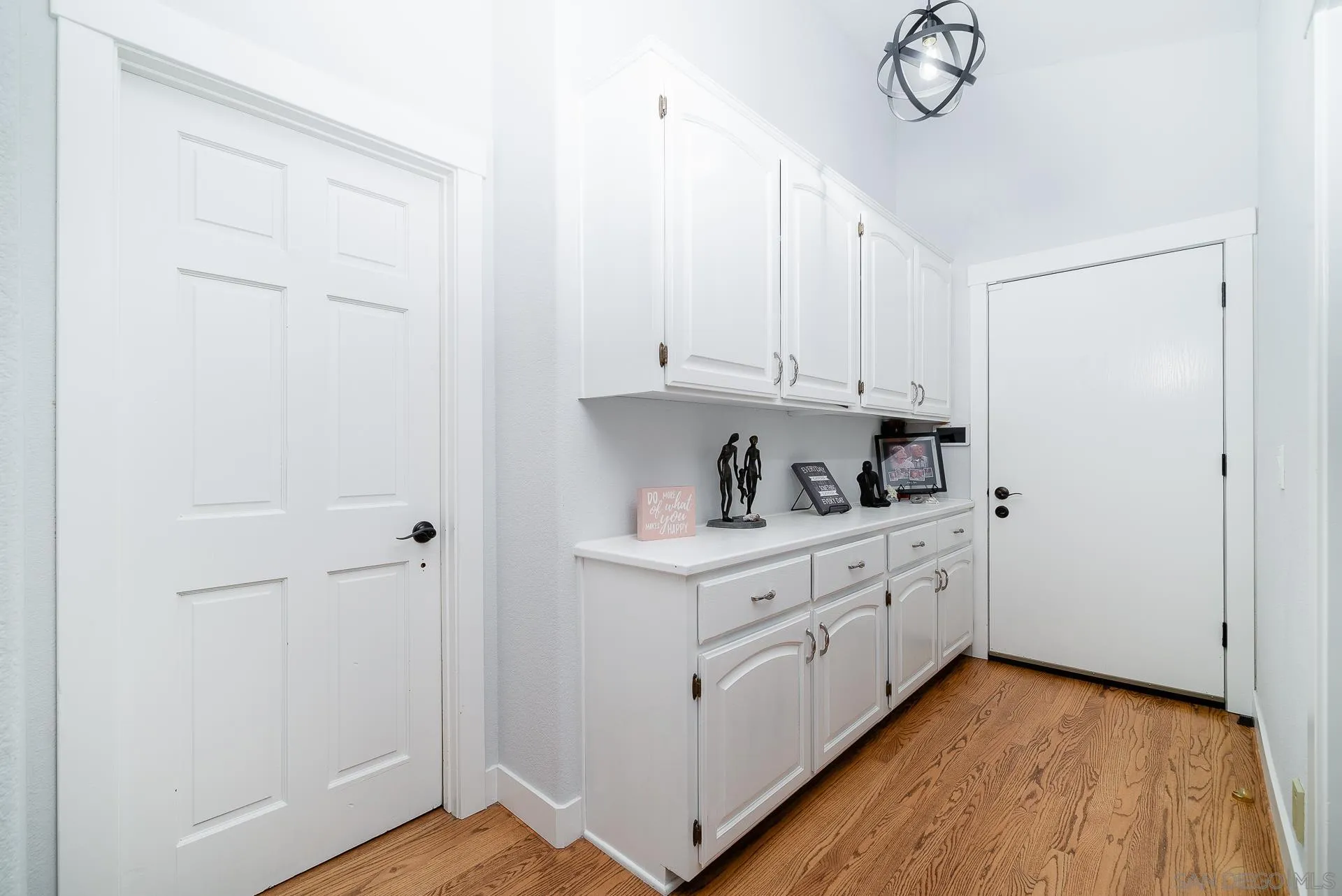 14574 Millards Road Poway, CA 92064 - Photo 38 of 75 a kitchen with granite countertop white cabinets and white appliances
