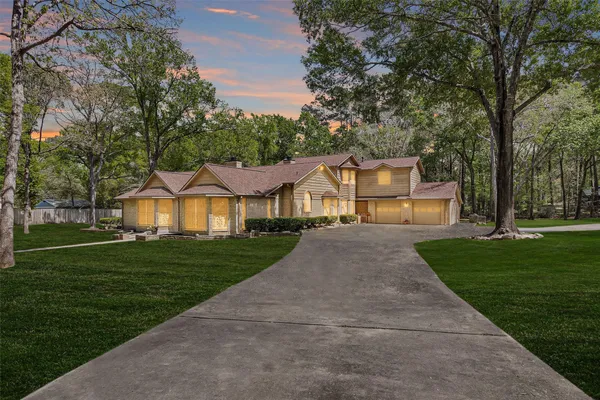 a front view of a house with a yard table and chairs
