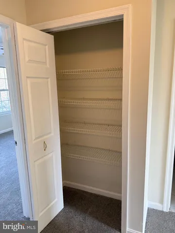 a view of empty room with windows