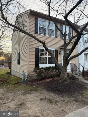 a view of a house with wooden deck