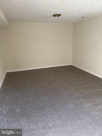 a bathroom with a sink mirror vanity and toilet