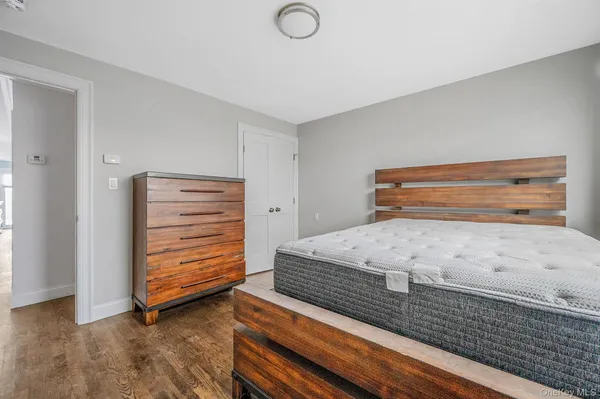 a bedroom with bed and window