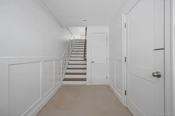 a view of a hallway with stairs