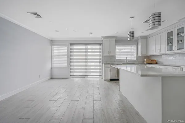 a kitchen with stainless steel appliances granite countertop a stove and a sink