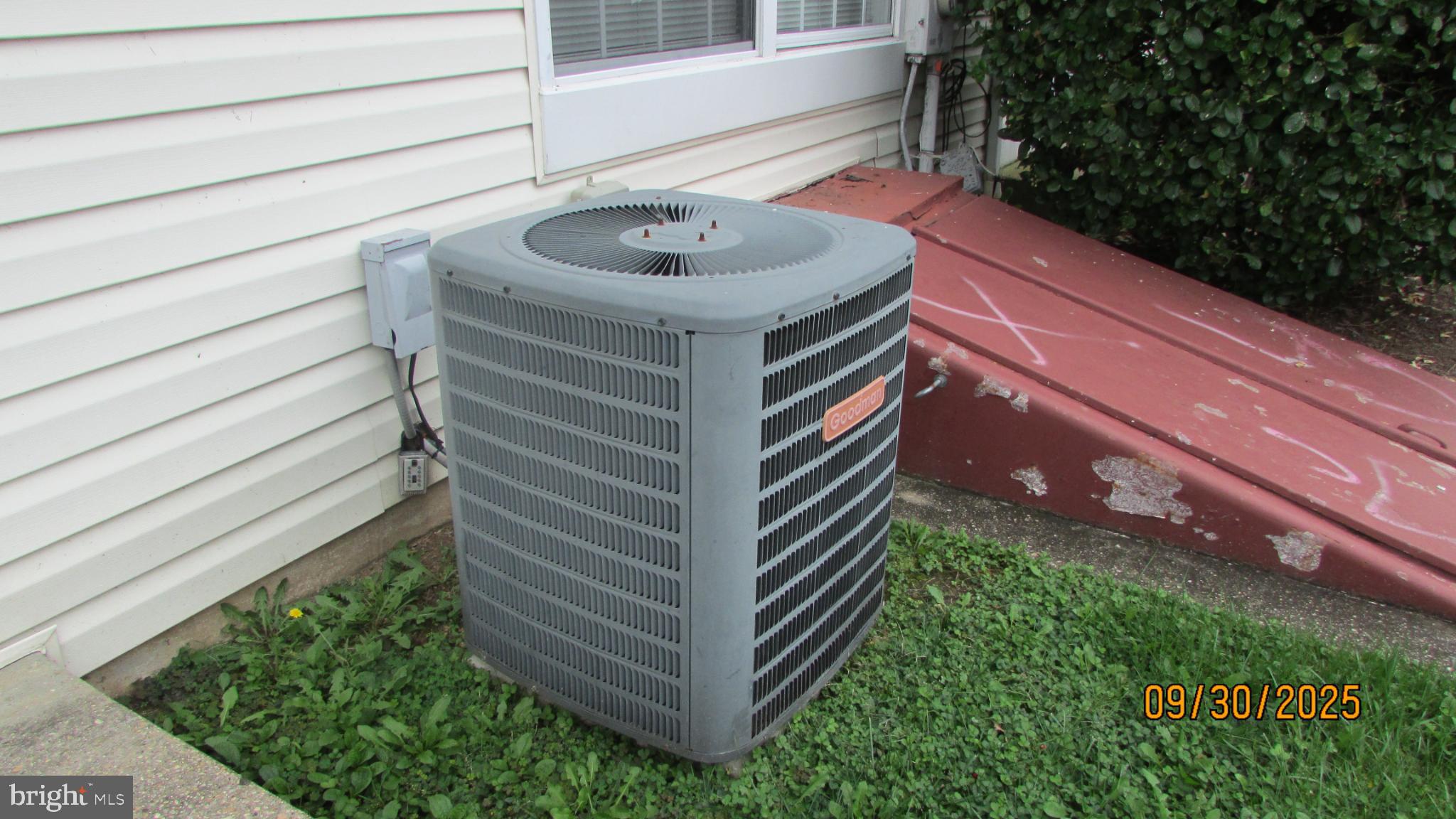 4805 Berwyn House Road, Unit A4805 College Park, MD 20740 - Photo 17 of 17 Cooling unit beside a charming residence.