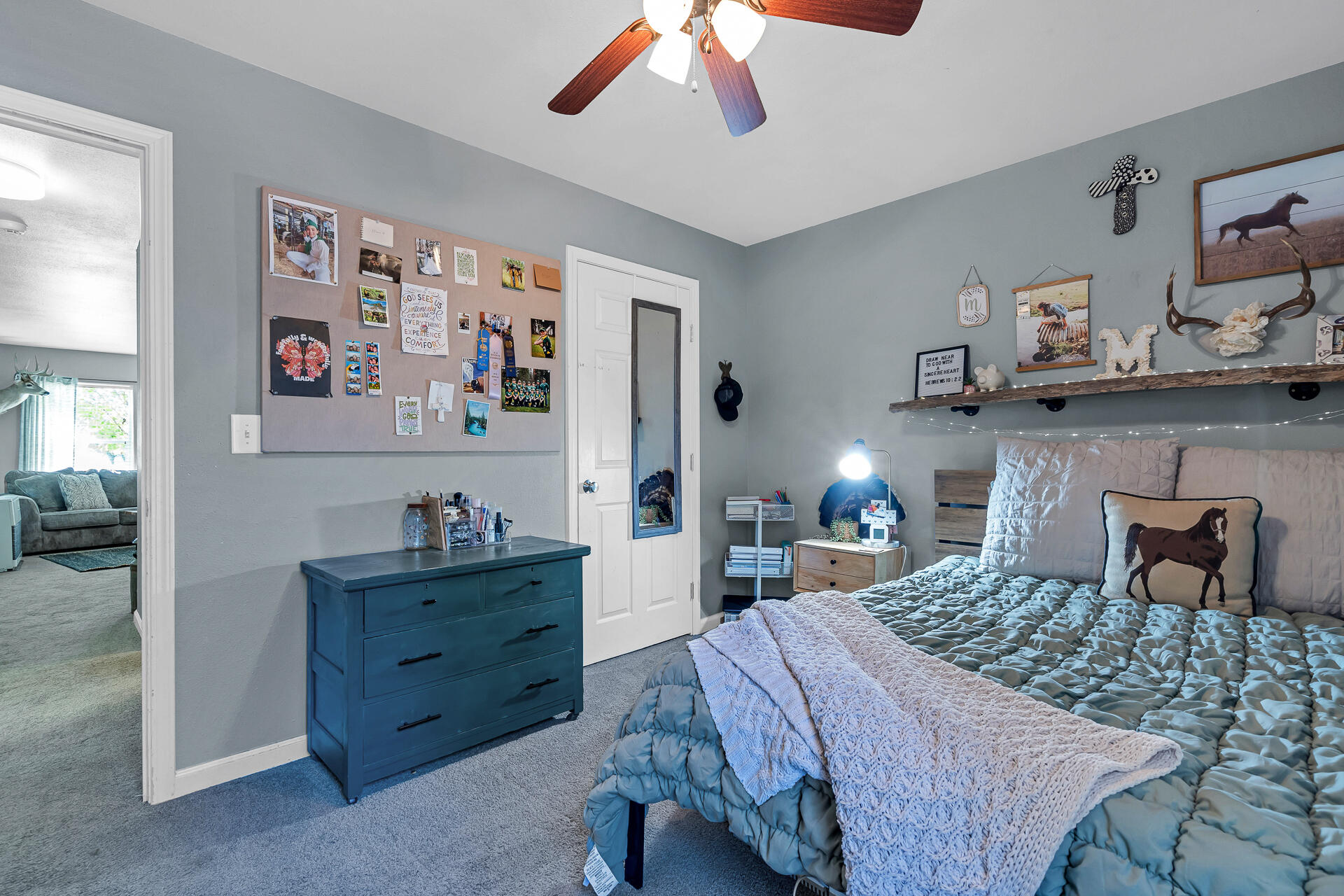 42048 Wilcox Road Hat Creek, CA 96040 - Photo 109 of 134 a bedroom with a bed and a chandelier