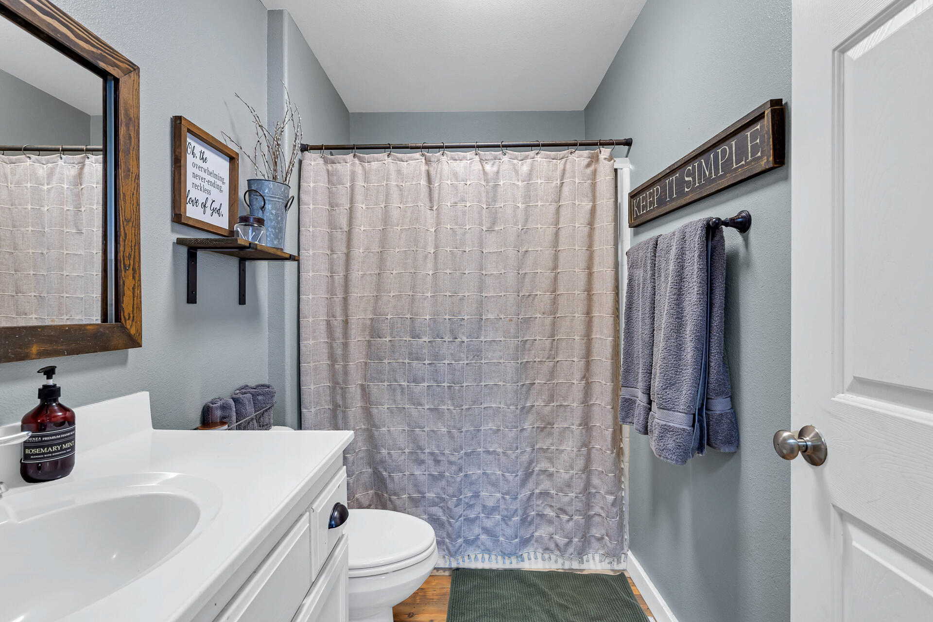 42048 Wilcox Road Hat Creek, CA 96040 - Photo 111 of 134 a bathroom with a sink a toilet and shower curtain