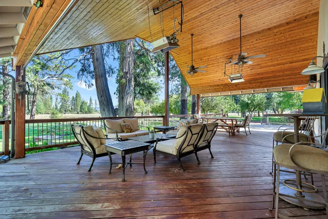 a living room with furniture and flat screen tv