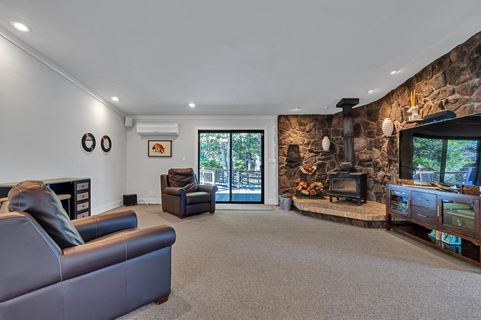 42048 Wilcox Road Hat Creek, CA 96040 - Photo 21 of 134 a living room with furniture and a flat screen tv