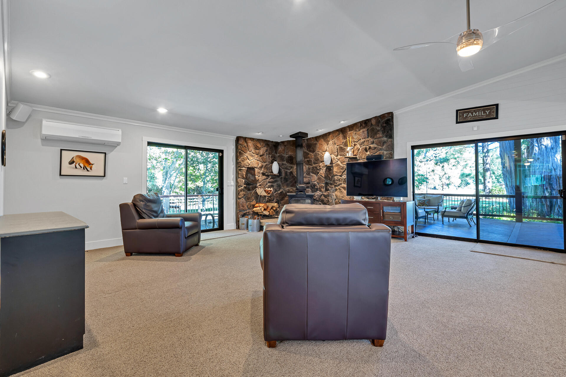 42048 Wilcox Road Hat Creek, CA 96040 - Photo 22 of 134 a living room with furniture and a flat screen tv