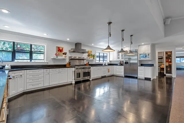 a view of a park with large trees