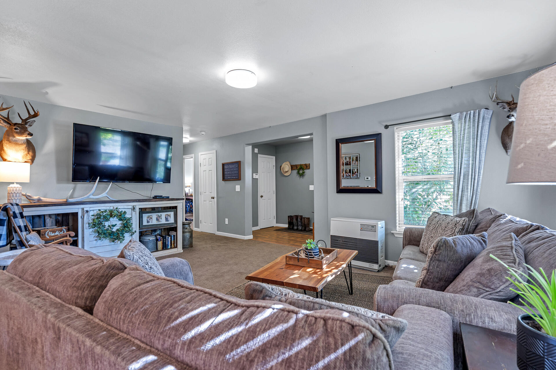 42048 Wilcox Road Hat Creek, CA 96040 - Photo 91 of 134 a living room with furniture and a flat screen tv