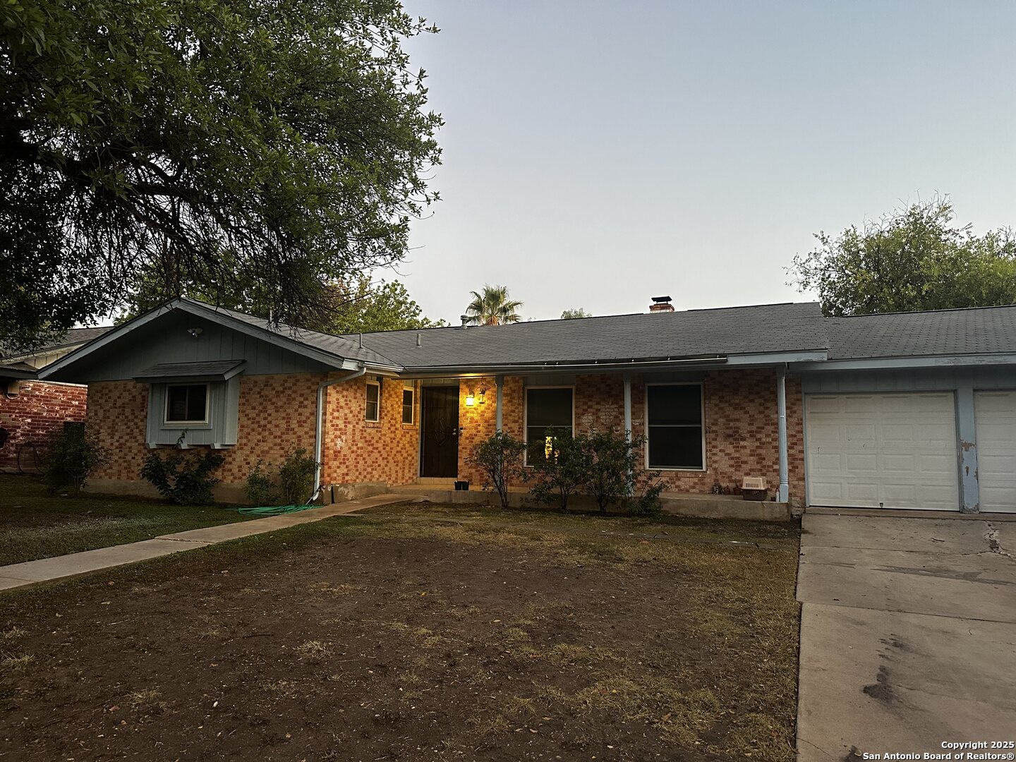 5910 Rimkus Drive Leon Valley, TX 78238 - Photo 2 of 10 a front view of a house with a yard